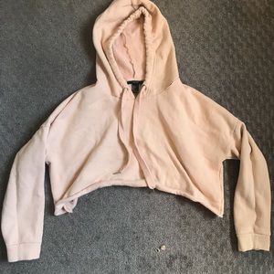 Peach colored cropped hoodie